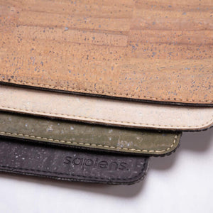 Multiple colors of cork leather laptop pads overlayed on top of one another